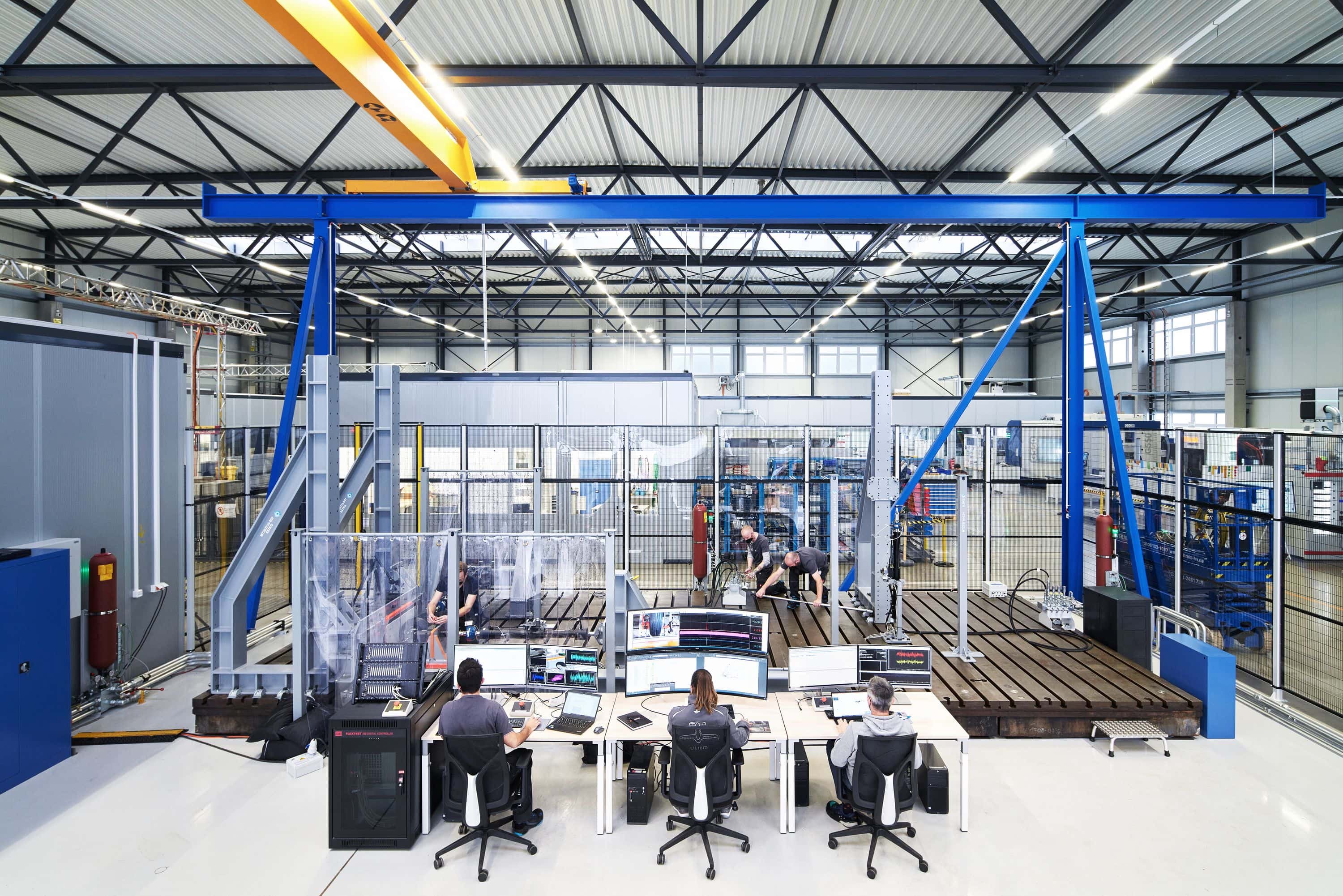 Members of the Lilium Structural Testing Team working on a test rig
